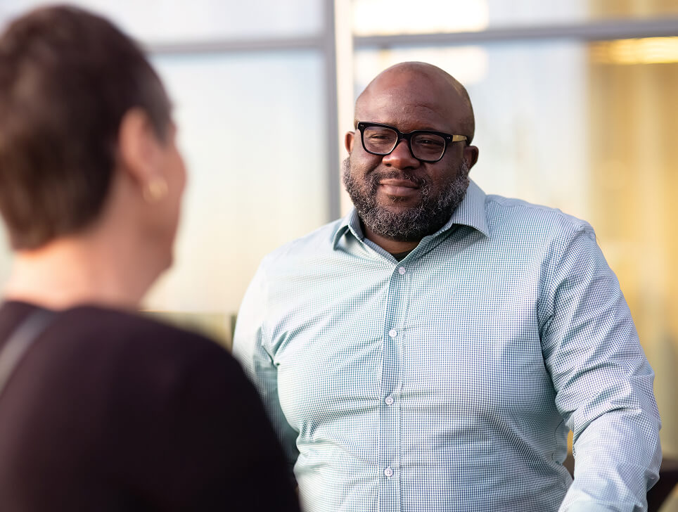 Clayton, patient advocate, listens to another advocate speaking.